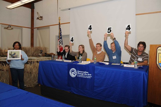 judges-hold-up-their-respective-scores.jpg