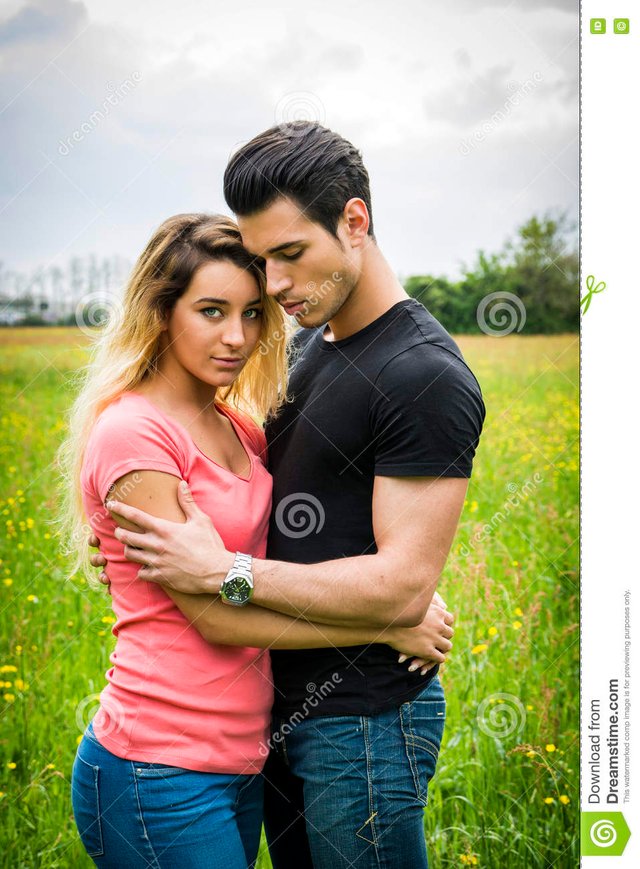 boyfriend-girlfriend-standing-showing-romantic-love-countryside-green-luscious-field-embracing-each-other-cuddling-79667358.jpg