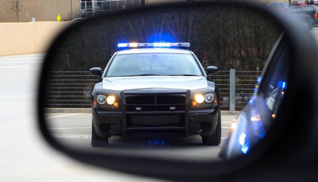 Police-in-rear-view-mirror.jpg