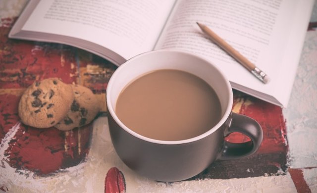 coffee-cup-and-cookies-on-table-with-book-in-background.jpg