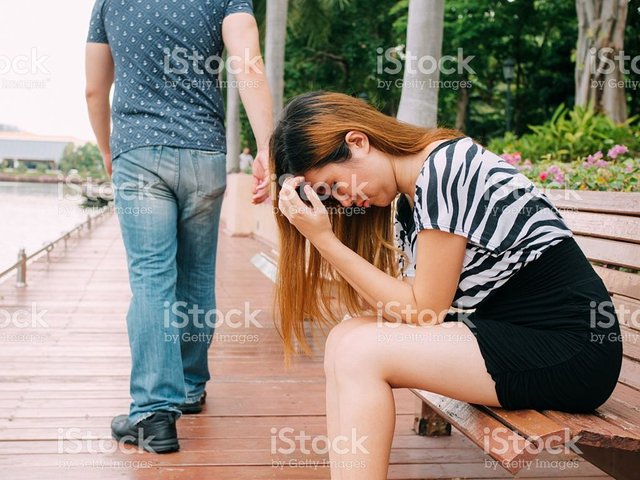 breakup-couple-with-sad-girlfriend-and-boyfriend-walking-away-picture-id544331632.jpg