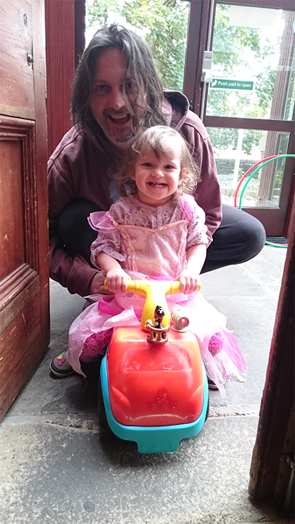 anarcotech and daughter riding the steem car.png