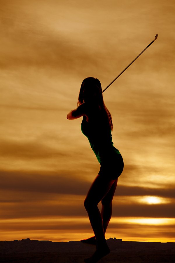 bigstock-Silhouette-Woman-Swinging-Club-50798897.jpg