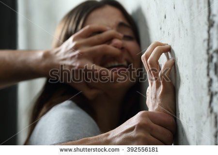 stock-photo-sexual-abuse-with-a-man-attacking-to-a-scared-woman-in-a-dark-place-392556181.jpg