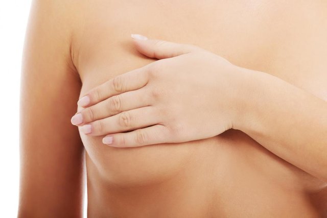 bare-chested-woman-covering-her-right-breast-with-her-left-hand.jpg