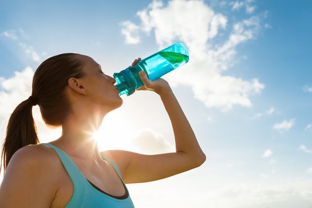 Woman-drinking-out-of-water-bottle.jpg