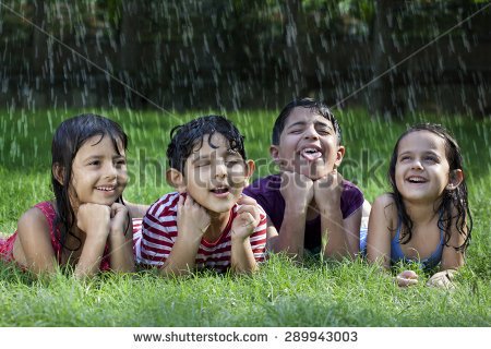 stock-photo-little-boys-and-girls-lying-on-grass-enjoying-rain-289943003.jpg