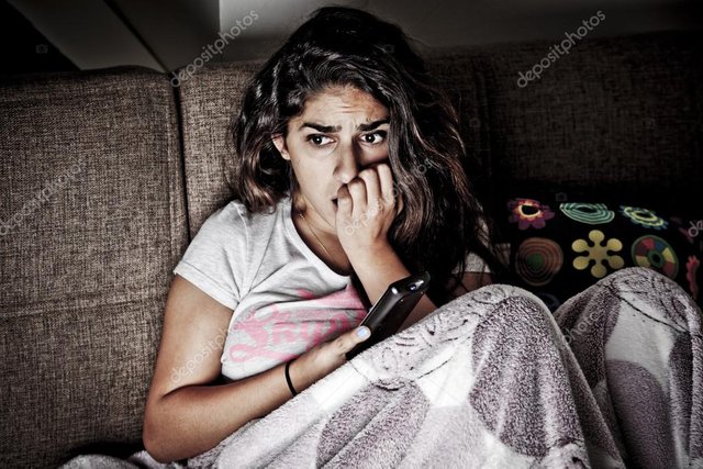 depositphotos_54508627-stock-photo-scared-young-woman-watching-tv.jpg