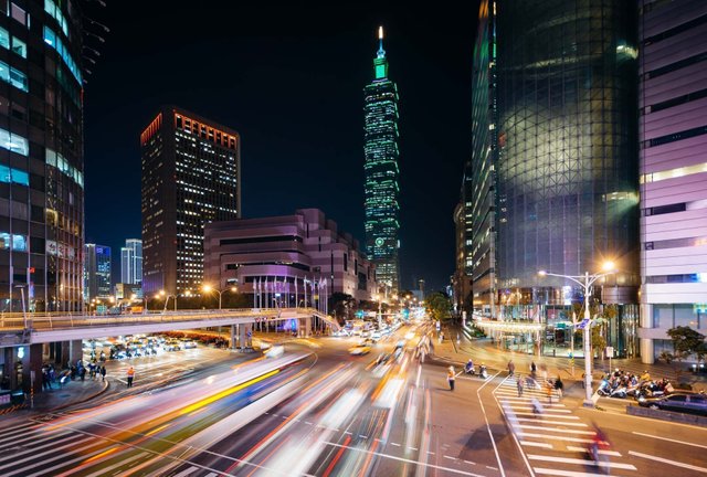traffic-on-xinyi-road-and-view-of-taipei-101-at-night-in-taipei-taiwan-photo-print-on-canvas-metal-or-framed.jpg