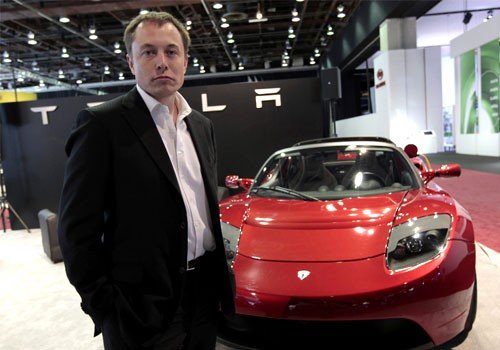 tesla-motors-ceo-elon-musk-with-tesla-roadster_100318276_m.jpg