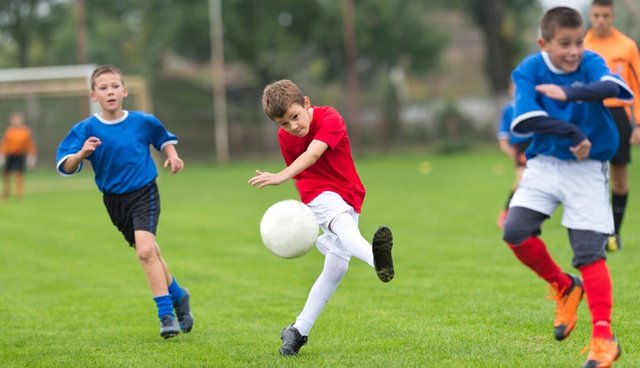 kids kick a ball.jpg