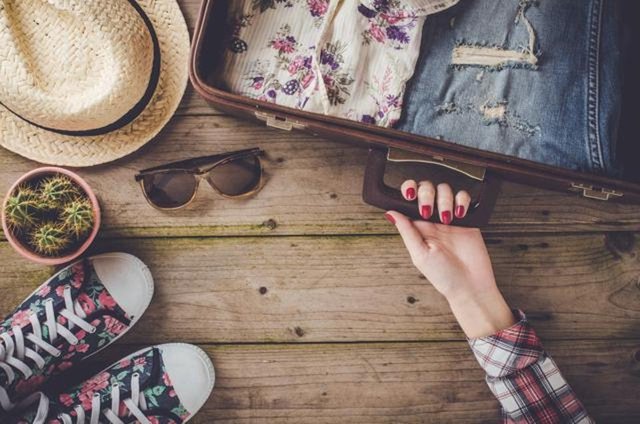 travel-preparations-on-wooden-table_4dd75450-df14-11e6-a538-54bd197a5a1b.jpg