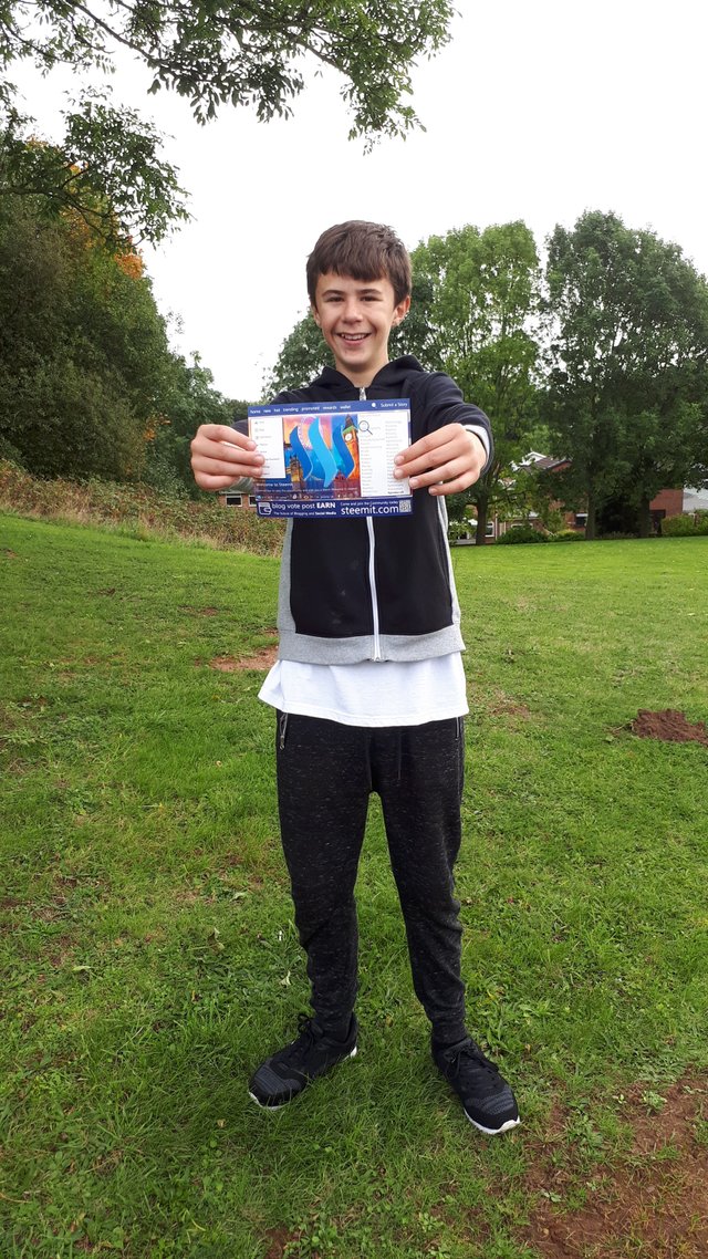 phot of me holding a promo-uk flyer.jpg