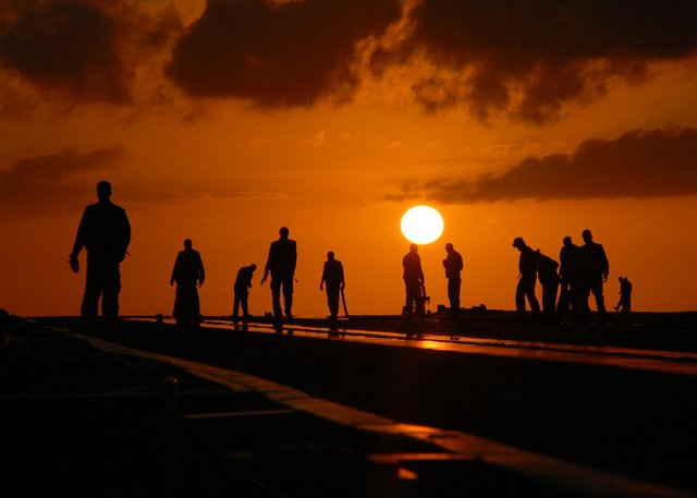 dark-sillhouettes-red-orange-sky-yellow-sun-freedomain.jpg