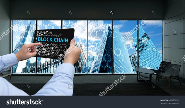 stock-photo-cryptocurrency-blockchain-and-bitcoin-concept-distributed-ledger-technology-man-holding-tablet-480473083.jpg