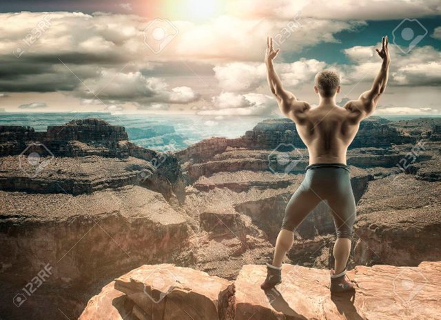 63596575-unrecognizable-brave-man-stands-on-top-of-the-mountain-toned-and-stylized-photo-collage(1).jpg