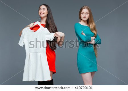 stock-photo-happy-cheerful-young-woman-and-envious-angry-female-on-shopping-over-grey-background-410729101.jpg