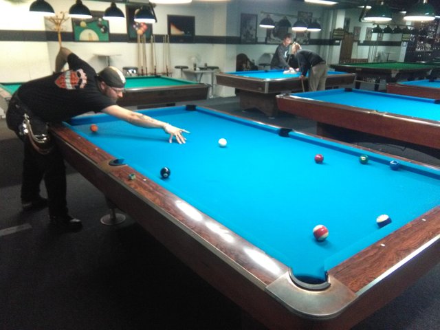 Playing billiards with my friend Janne