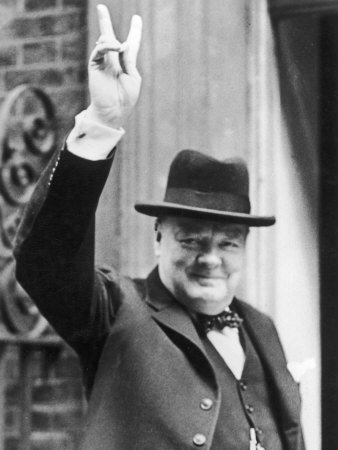 10023814-FB-Winston-Churchill-British-Statesman-and-Author-Gives-the-V-Sign-in-1940-Posters.jpg