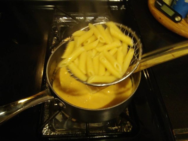 mac and cheese 17 strain pasta put in cheese.jpg