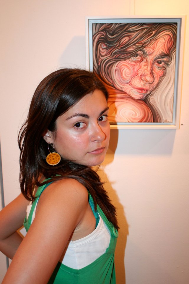 Eleftheria next to her portrait.JPG