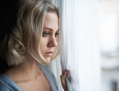 depressed-woman-looking-out-window-500 (3).jpg