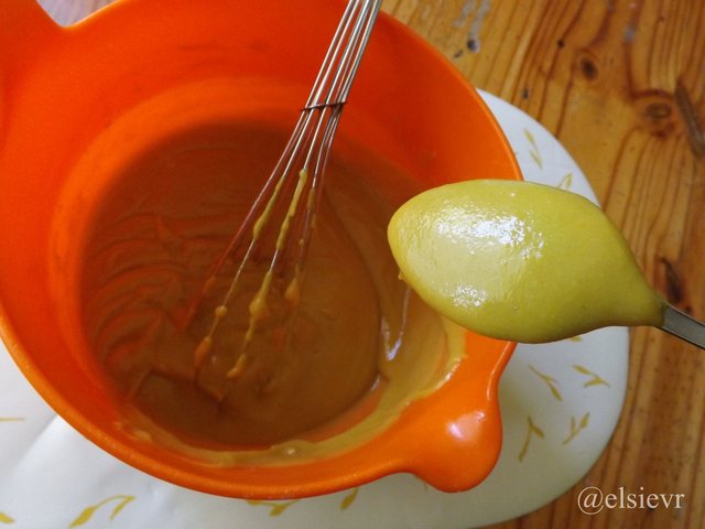 orange plastic bowl with mustard test on back of spoon.jpg