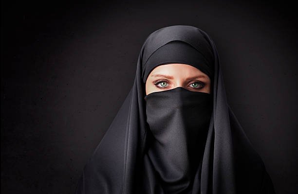 muslim-woman-with-traditional-black-veil-picture-id469645332.jpeg