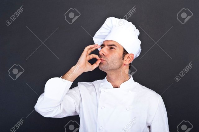 25415966-Male-chef-kissing-fingers-against-grey-background-Stock-Photo.jpg