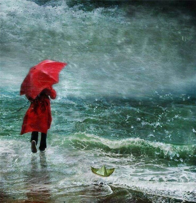 mujer-con-paraguas-en-el-mar.jpg