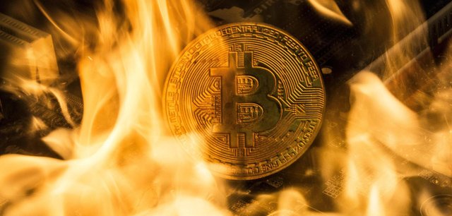 Symbol-photo-Bitcoin-crash-The-picture-shows-a-burning-Bitcoin-2.jpg