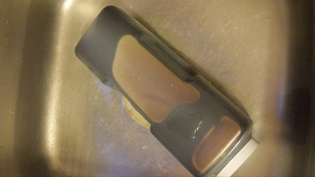 Liquid malt extract bottle in a sink