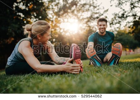 stock-photo-fitness-couple-stretching-outdoors-in-park-young-man-and-woman-exercising-together-in-morning-529544062.jpg