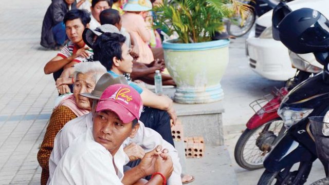 6_ethnic-vietnamese-sit-in-line-as-they-wait-for-immigration-authorities-to-check-their-documents-during-a-crackdown-yesterday-in-phnom-penh_s-chroy-changvar-district_sahiba-chawdhary.jpg