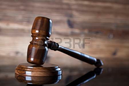 83993360-auction-and-business-concept-gavel-on-the-wooden-background-.jpg