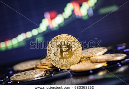 stock-photo-bitcoin-gold-coin-and-defocused-chart-background-virtual-cryptocurrency-concept-680368252.jpg