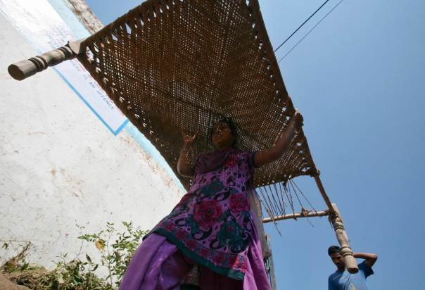 lady with a string cot.JPG