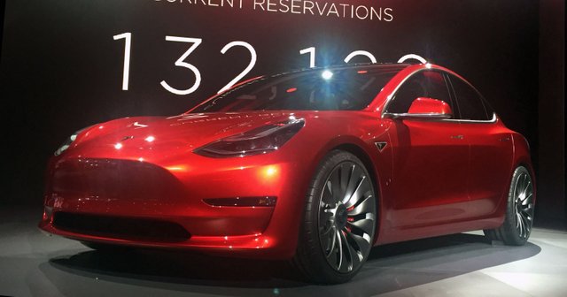 Candy_Red_Tesla_Model_3_trimmed_2.jpg