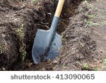 stock-photo-shovel-on-a-background-of-the-trench-413090065.jpg