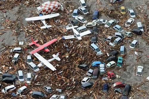 2011-march-11-japan-earthquake-sendai-airport-cars-planes.jpg