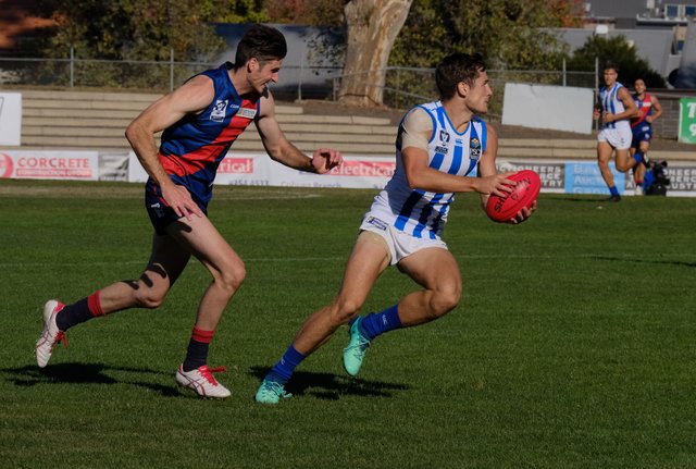 Mitch Hibberd about to get run down (and injured).jpg