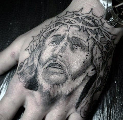 guy-with-christian-jesus-christ-tattoo-design-on-hand.jpg