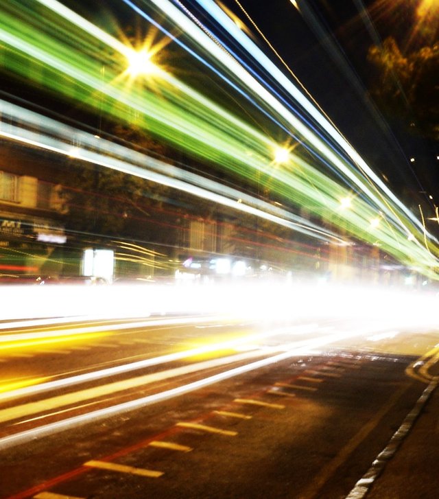 10287966599 - buses pass on long exposure mare street hackney.jpg