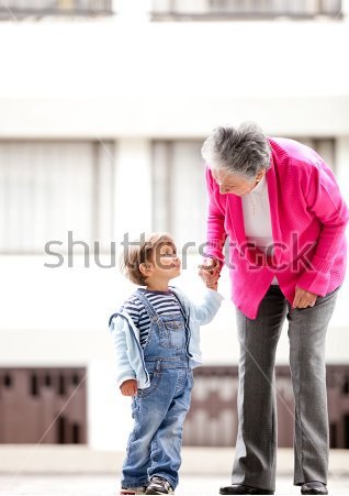 stock-photo-grandmother-and-children-taking-a-walk-outdoors-92526331.jpg