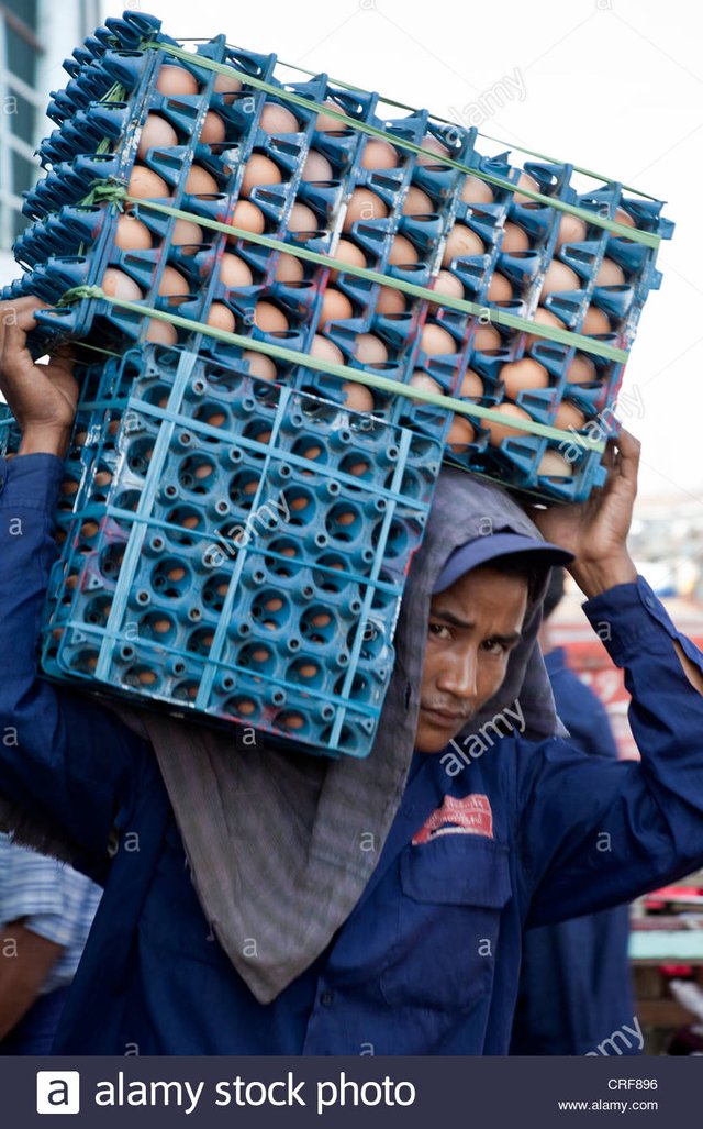 myanmar-burma-yangon-stevedores-carrying-crates-of-eggs-from-ship-CRF896.jpg