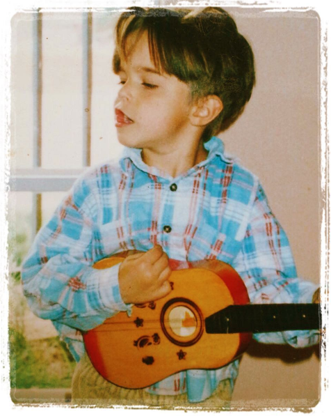 rhavi playing guitar child little.png