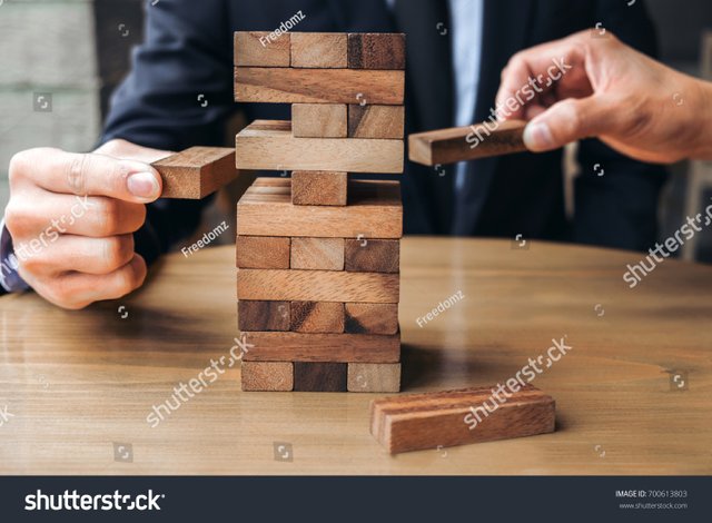 stock-photo-alternative-risk-concept-plan-and-strategy-in-business-young-intelligent-businessman-playing-the-700613803.jpg