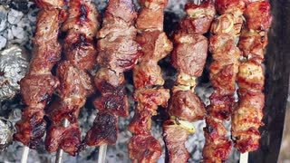 grilled-meat-man-takes-off-skewers-with-cooked-meat-from-grill-bbq-meat-ready-barbeque-meat-tasty-shish-kebab-on-skewers-grilled-barbecue-meat-grilled-food-for-picnic-prepared-barbecue-food_btvmewlx__S0000.jpg