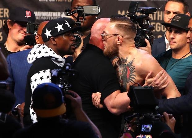 mayweather-mcgregor-pile-up.jpg