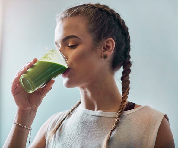 Woman-drinking-green-juice-1252988.jpg